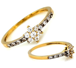 złoty pierścionek z kamieniami