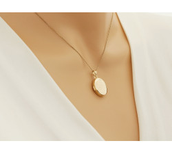 Złota zawieszka 585 puzderko na fotografię owalne bez kamieni