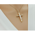 Złota przywieszka w kształcie krzyżyka, klasyczny symbol religijny