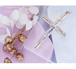 Złota przywieszka w kształcie krzyżyka, klasyczny symbol religijny
