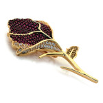 Złota broszka z cyrkoniami dla kobiety