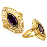 Duży złoty pierścień z fioletowym kamieniem