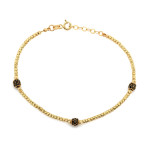 Złota bransoletka z błyszczących kulek