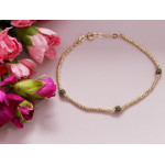 Złota bransoletka z błyszczących kulek