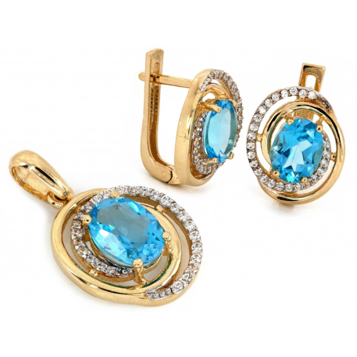 Złote kolczyki i zawieszka z niebieskim oczkiem