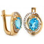 Złote kolczyki i zawieszka z niebieskim oczkiem