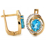 Złote kolczyki i zawieszka z niebieskim oczkiem