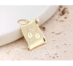 Złota przywieszka z symbolem znaku zodiaku