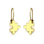 złote kolczyki puzzle na biglu